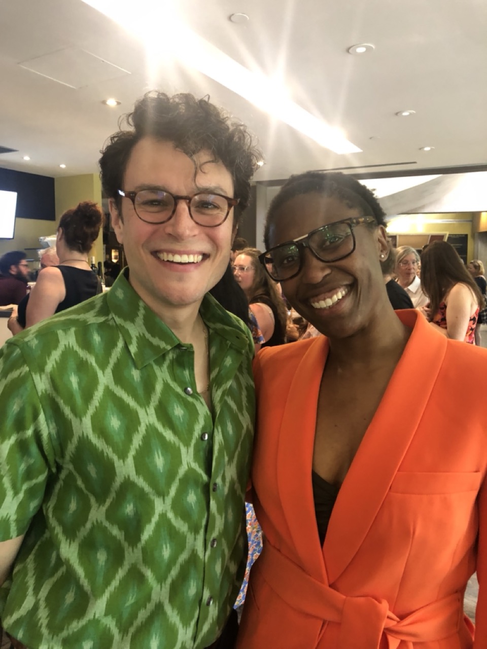 Lisa and Andrew are dressed formally, they both smile at the camera 